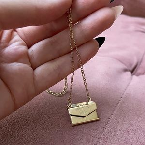 The Vampire’s Wife H&M gold letter envelope necklace